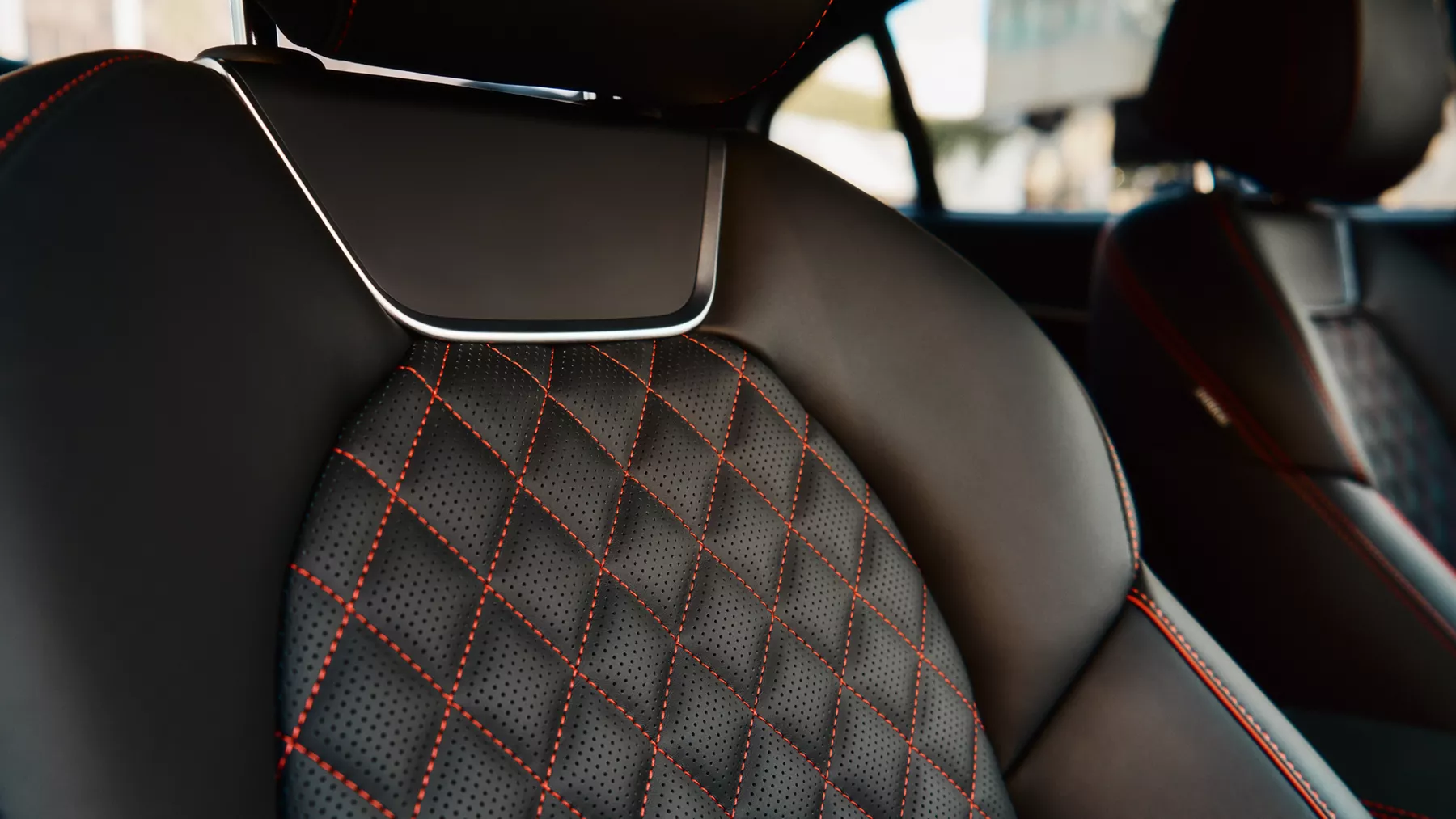 Black G70 front seat with red diamond stitching. 