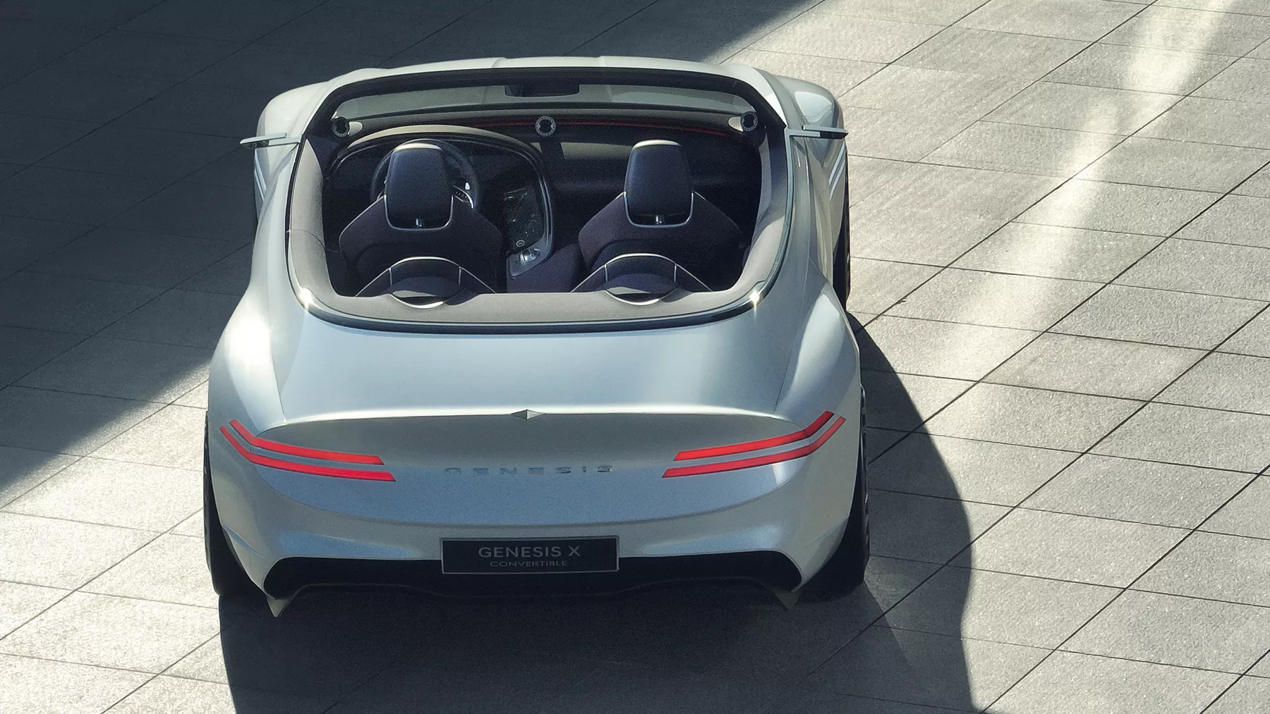 Rear view of X Convertible Concept with taillight illuminated.