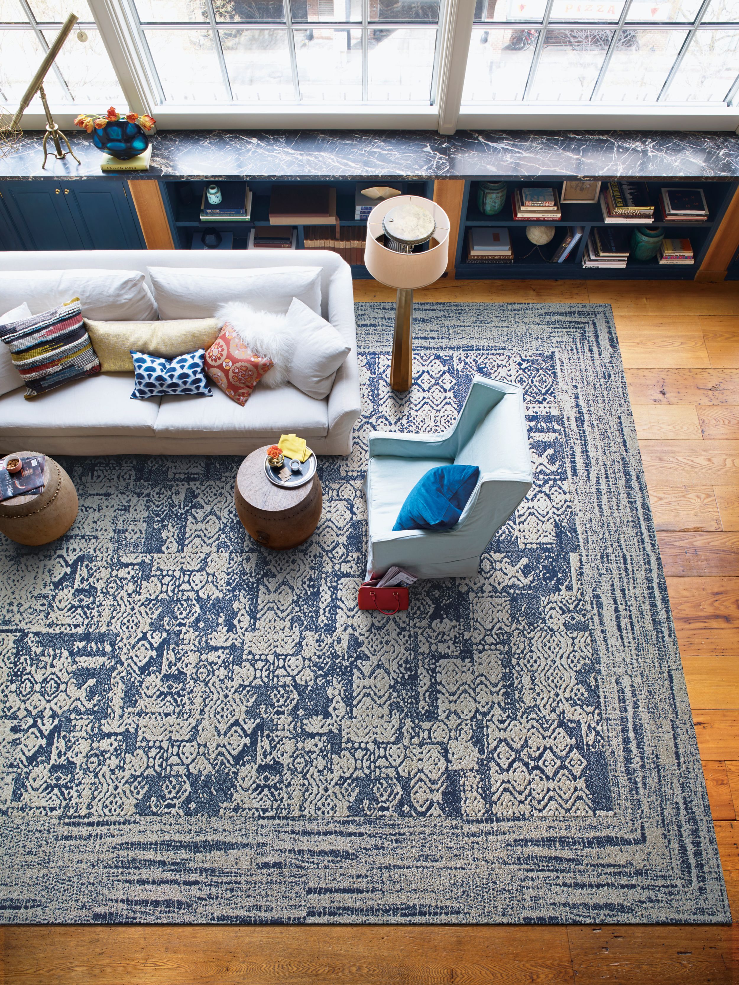Interface PM01, PM39, and PM49 plank carpet tile in overhead view of living room area with light colored furniture image number 2