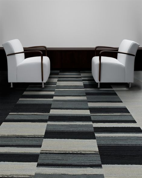 Interface Across the Board and On Board carpet tile in waiting area with two chairs