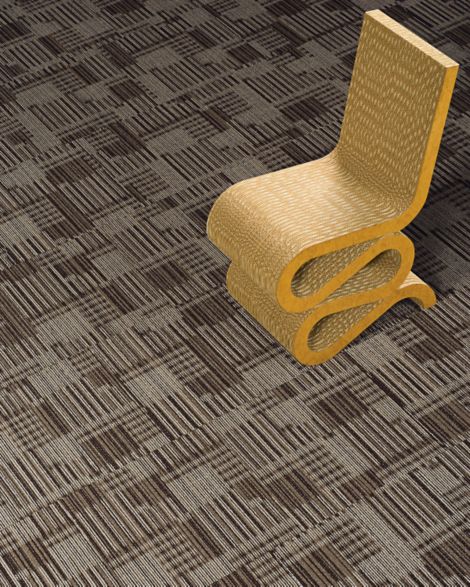 Detail of Interface Cordoba carpet tile with gold chair