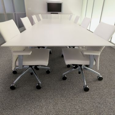 Interface Broomed carpet tile in conference room with long white table and chairs