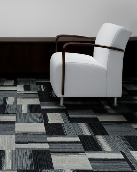 Interface Across the Board carpet tile in seating area with white chair image number 4