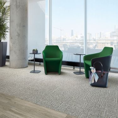 Interface Open Air 413 carpet tile with Natural Woodgrains LVT in lobby with green chairs image number 1
