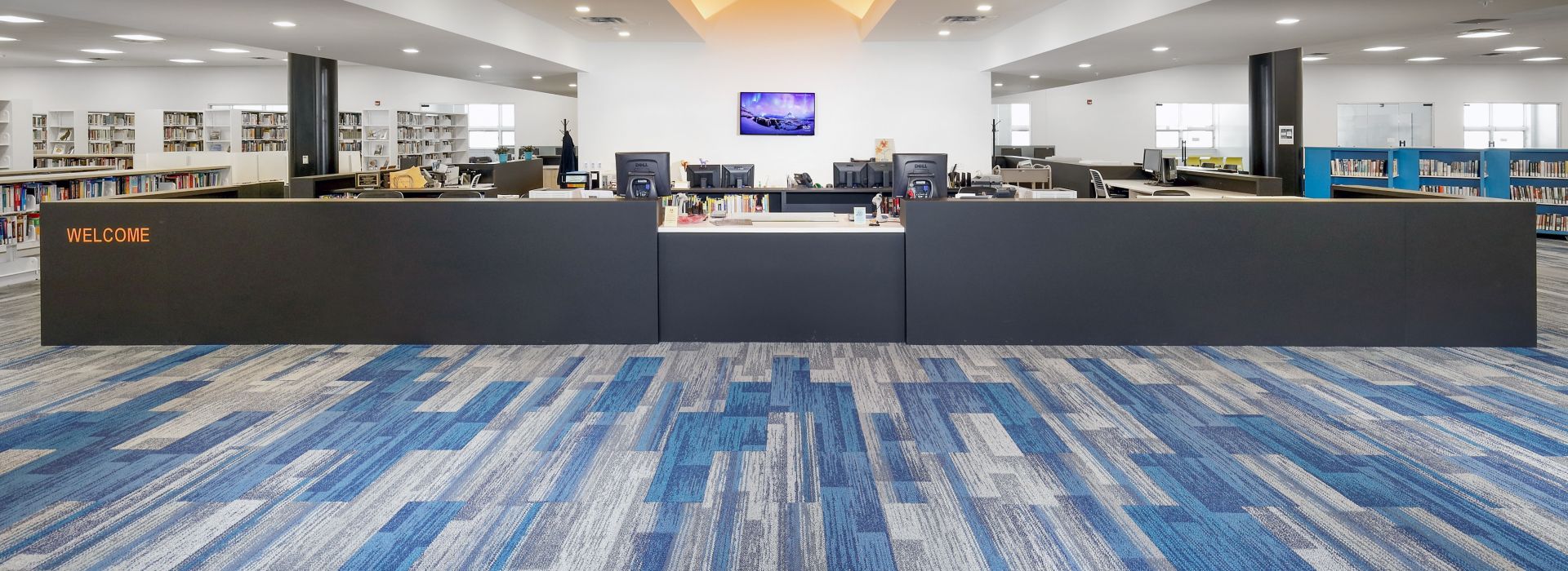 Interface Aerial Flying Colors AE315. AE317 and AE311 plank carpet tile in higher education library