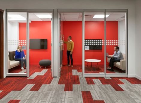 Interface Neighborhood Blocks plank carpet tile in office corridor and small meeting rooms with people working