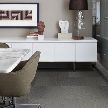Interface 1st Avenue carpet tile in private office with white credenza and artwork