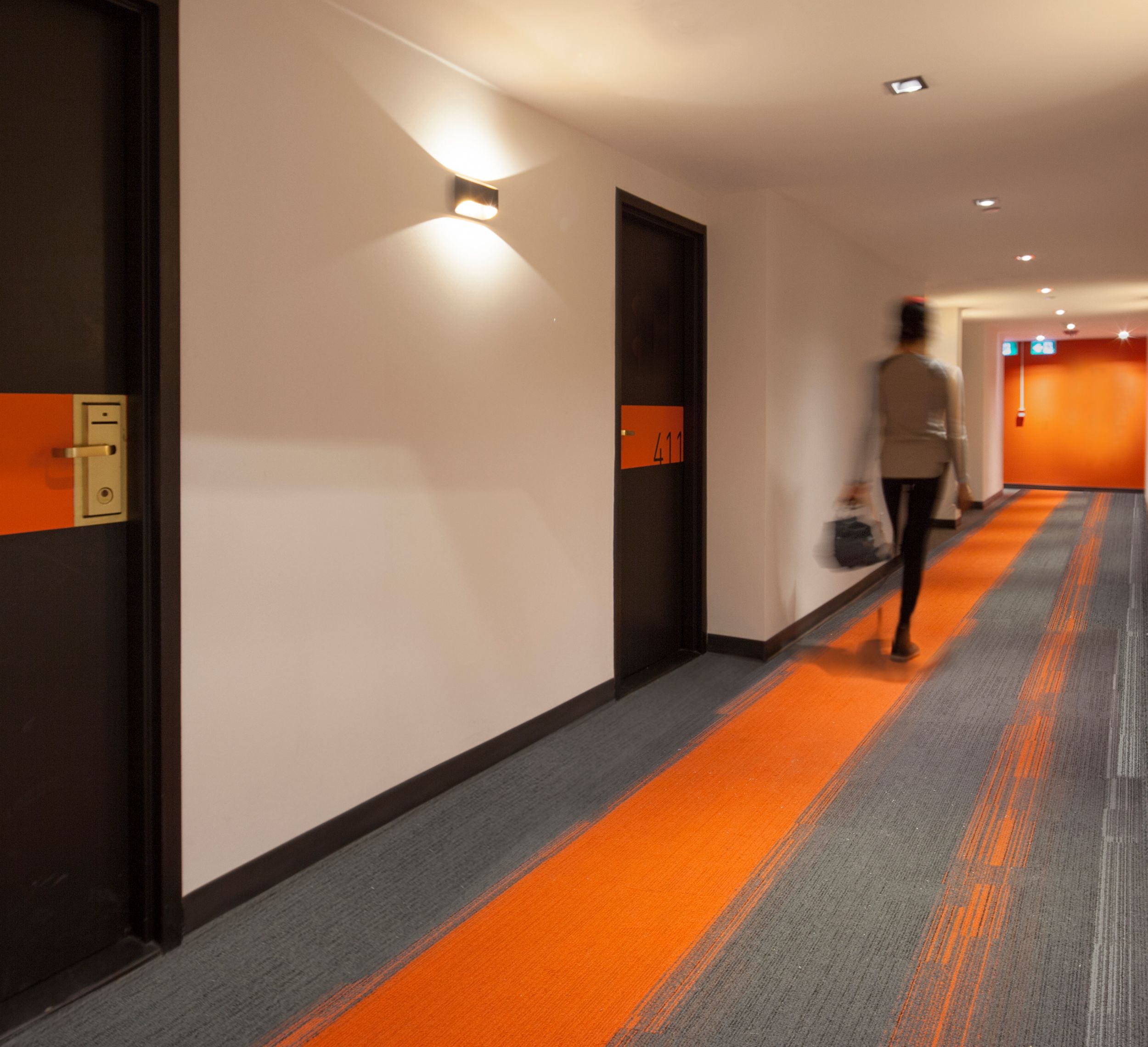 Interface Off Line plank carpet tile in long corridor with woman walking image number 16
