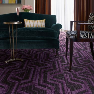 Interface PM19 plank carpet tile in living room area with green sofa zebra colored chair image number 1