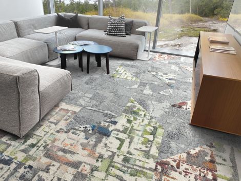 Interface Panola Mountain and Mountain Rock carpet tile in living room area with grey couch and blue center tables image number 4