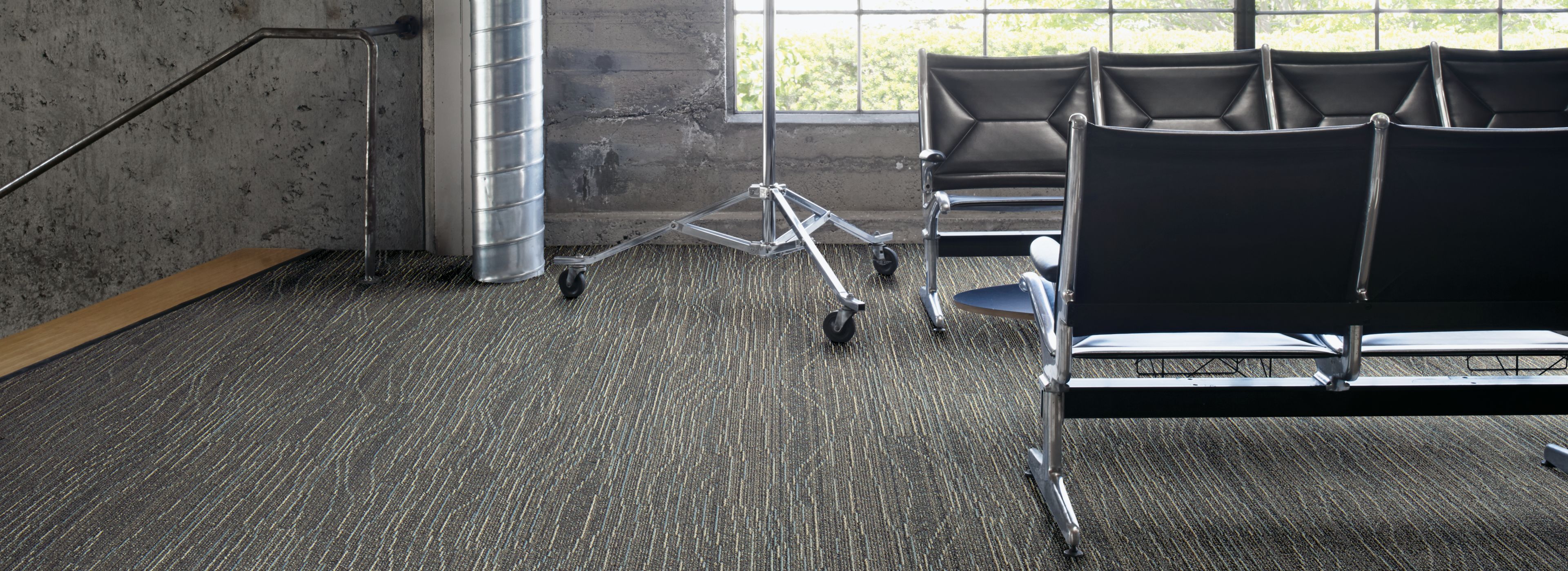 Interface Snow Moon plank carpet tile in waiting area with concrete walls and exposed beams numéro d’image 1
