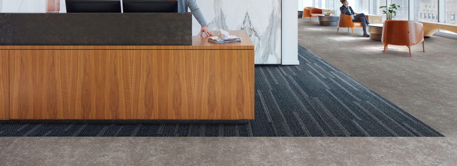 Interface Simple Sash plank carpet tile and Walk of Life LVT in a corporate lobby area with front desk 