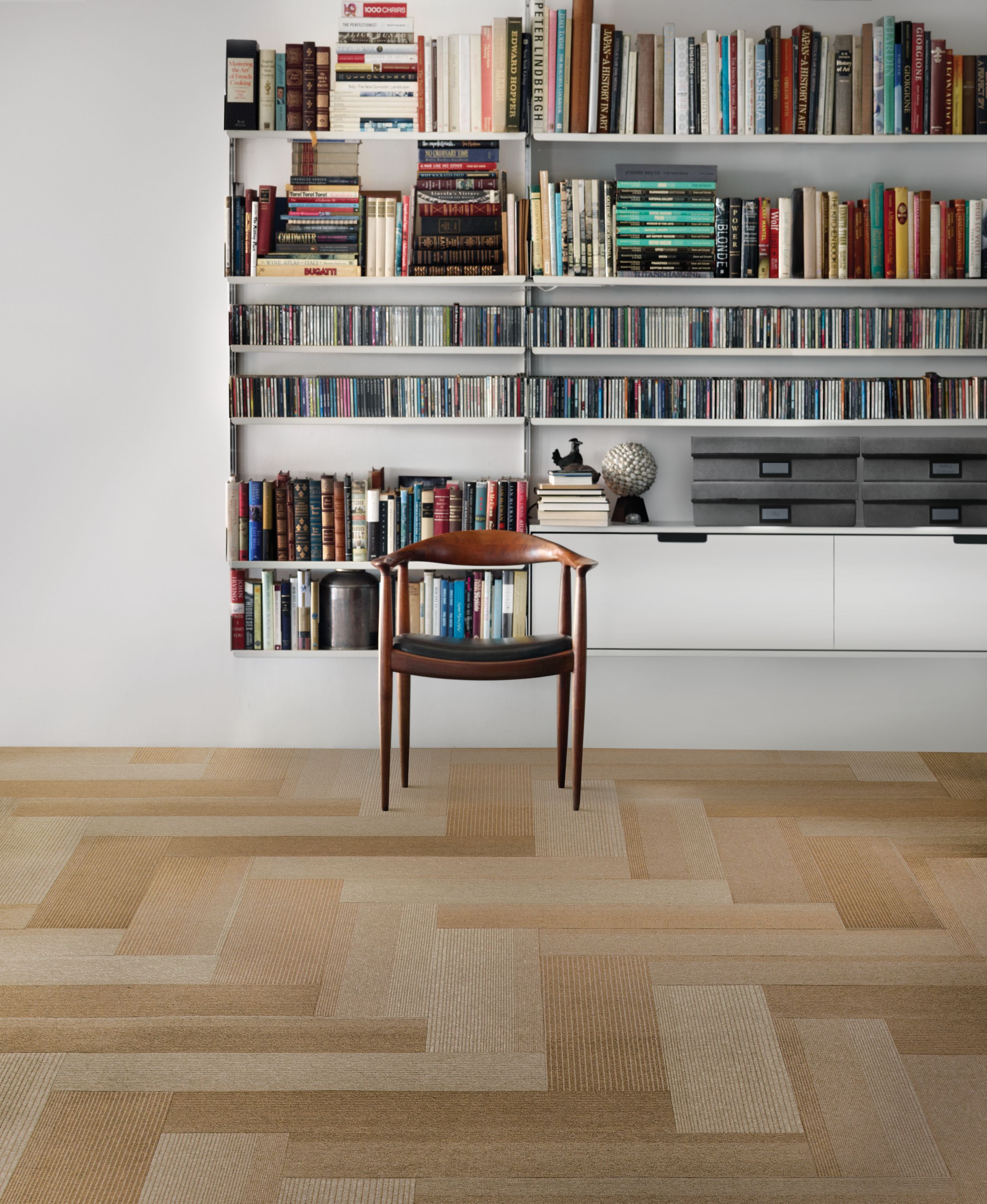 Interface B701 plank carpet tile in front of bookcase with wood chair image number 5