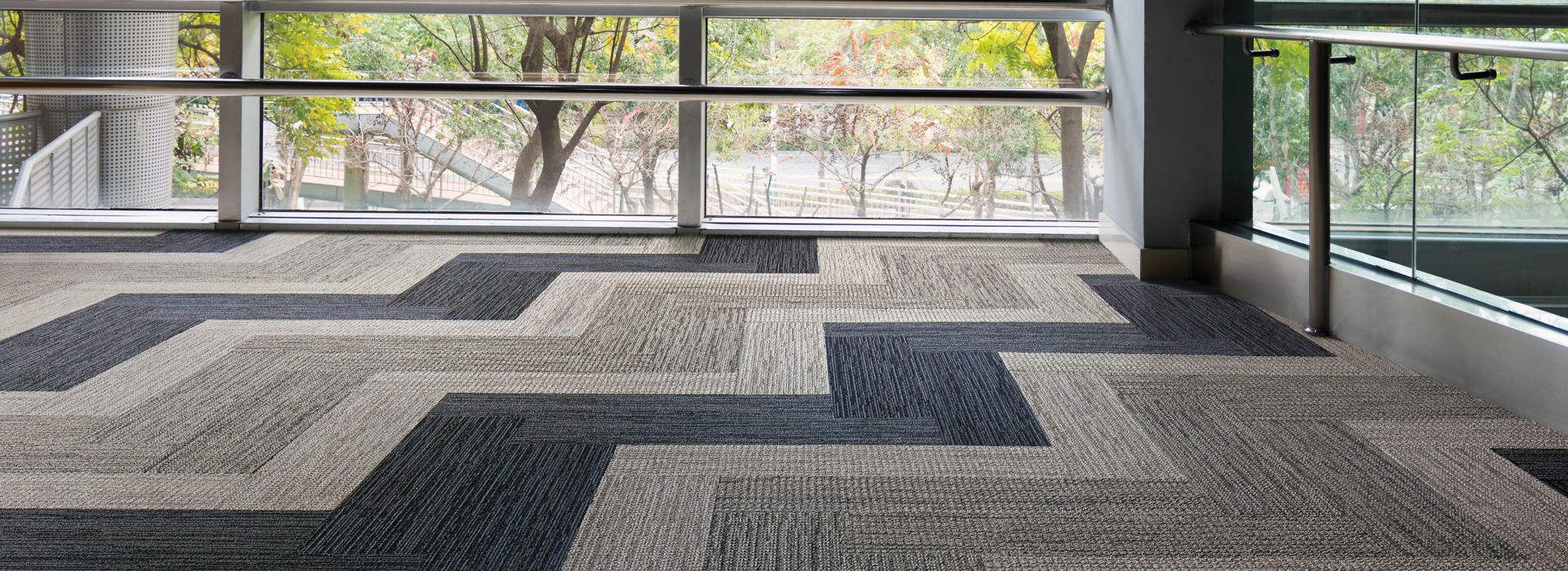 Interface Afternoon Light and Winter Sun carpet tile in open area with glass walls