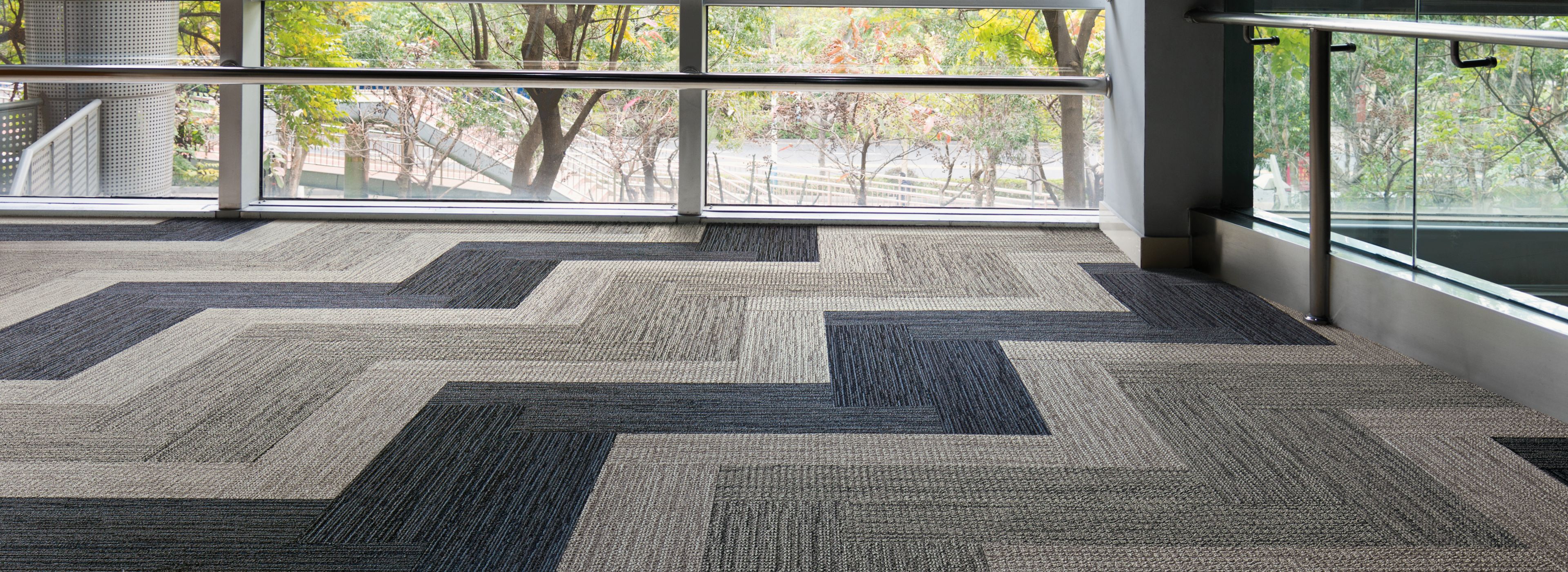 Interface Afternoon Light and Winter Sun carpet tile in open area with glass walls image number 1