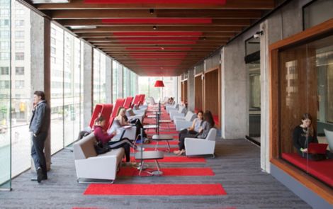 Interface HN810 and HN830 plank carpet tiles in long common space with red and wood ceiling and focus rooms image number 10