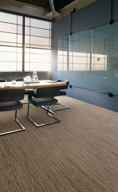 Interface Winter Sun plank carpet tile in meeting room with table and chairs