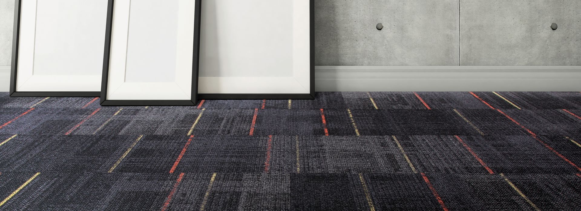 Interface AE312 carpet tile in open room with blank canvases against wall