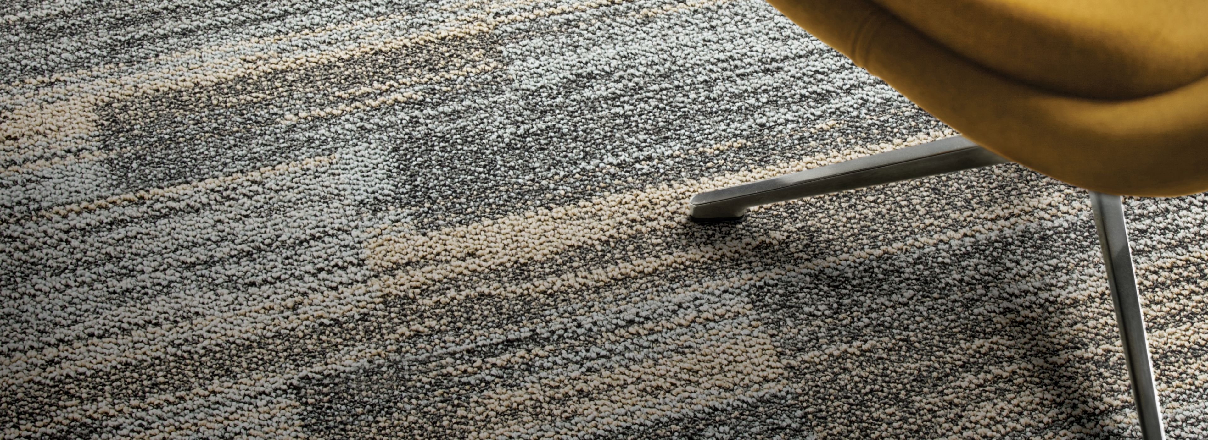 Close-up of Interface AE313 plank carpet tile with yellow chair imagen número 1