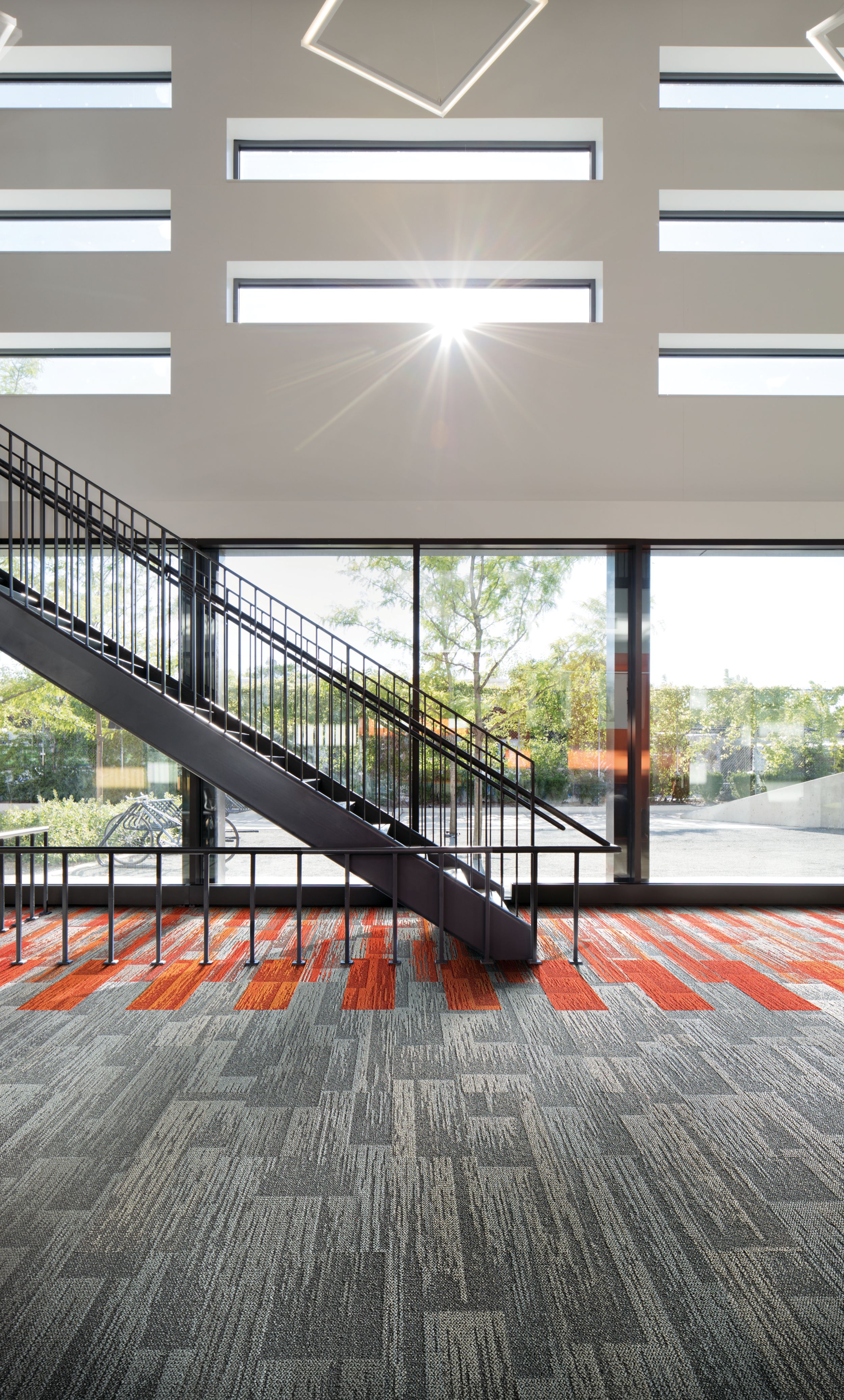 Interface Aerial Flying Colors AE311, AE315 and AE317 plank carpet tile in lobby with stairwell image number 2