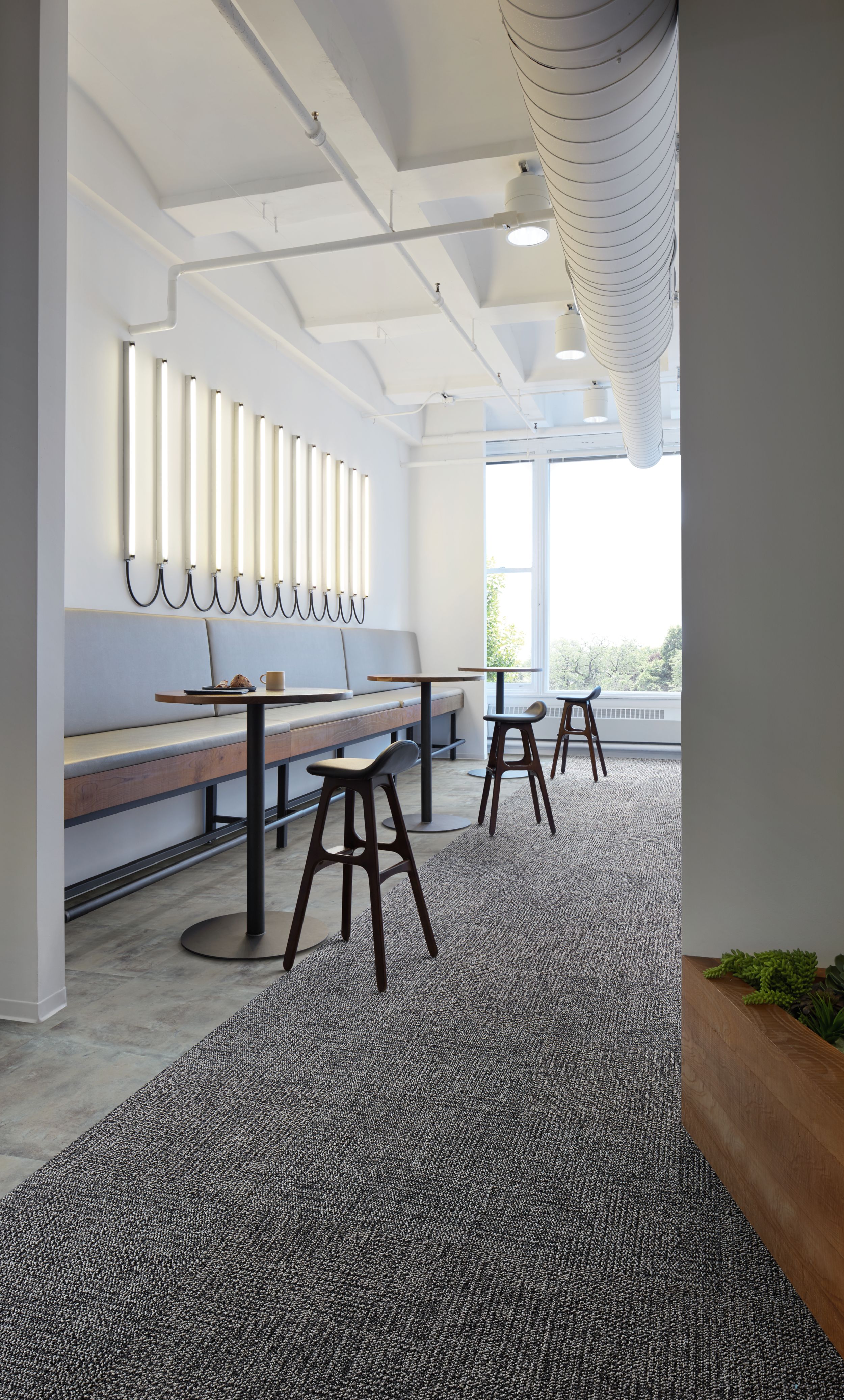 Interface Apple of My Eye carpet tile and Textured Stones LVT in narrow, cafe area image number 3