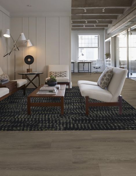 Interface Aquatint plank carpet tile with Textured Woodgrains LVT in seating area
