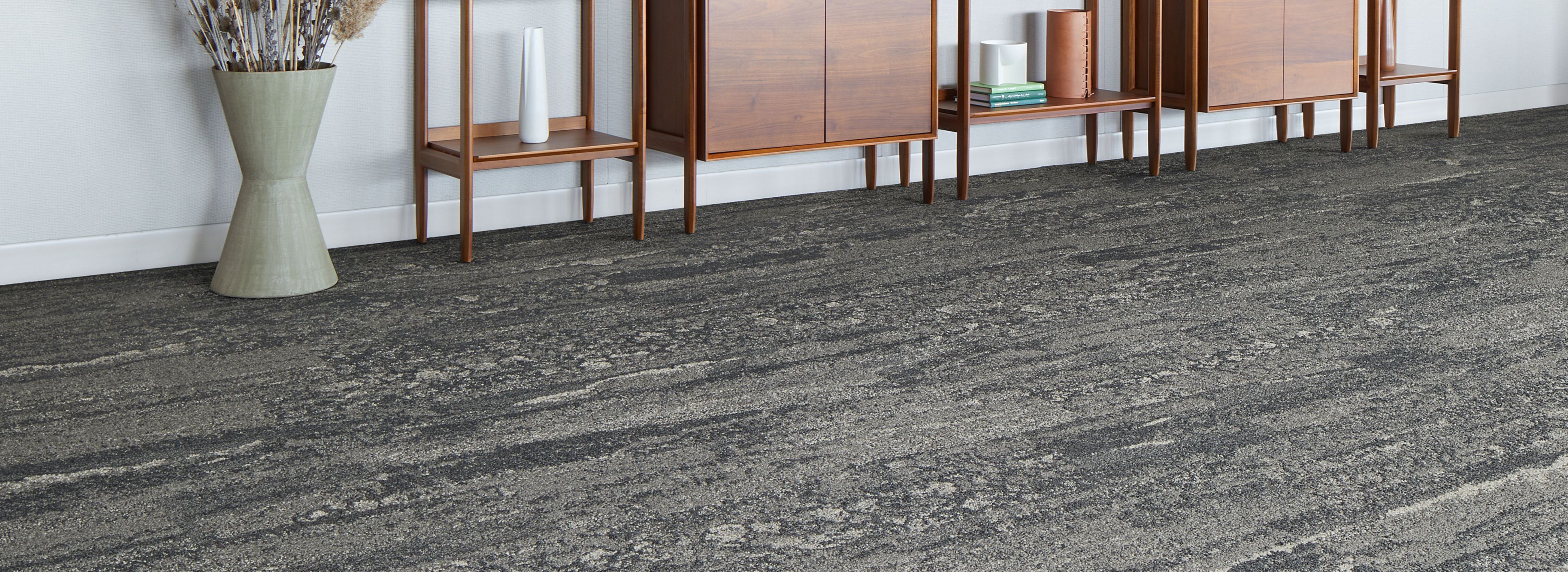 Interface Ferris plank carpet tile in lobby area with bookcases and large plant image number 1