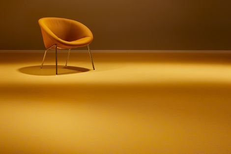 noraplan lona rubber flooring in open area with yellow chair image number 5