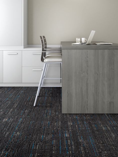 Interface Bitrate plank carpet tile in office area with desk and chair