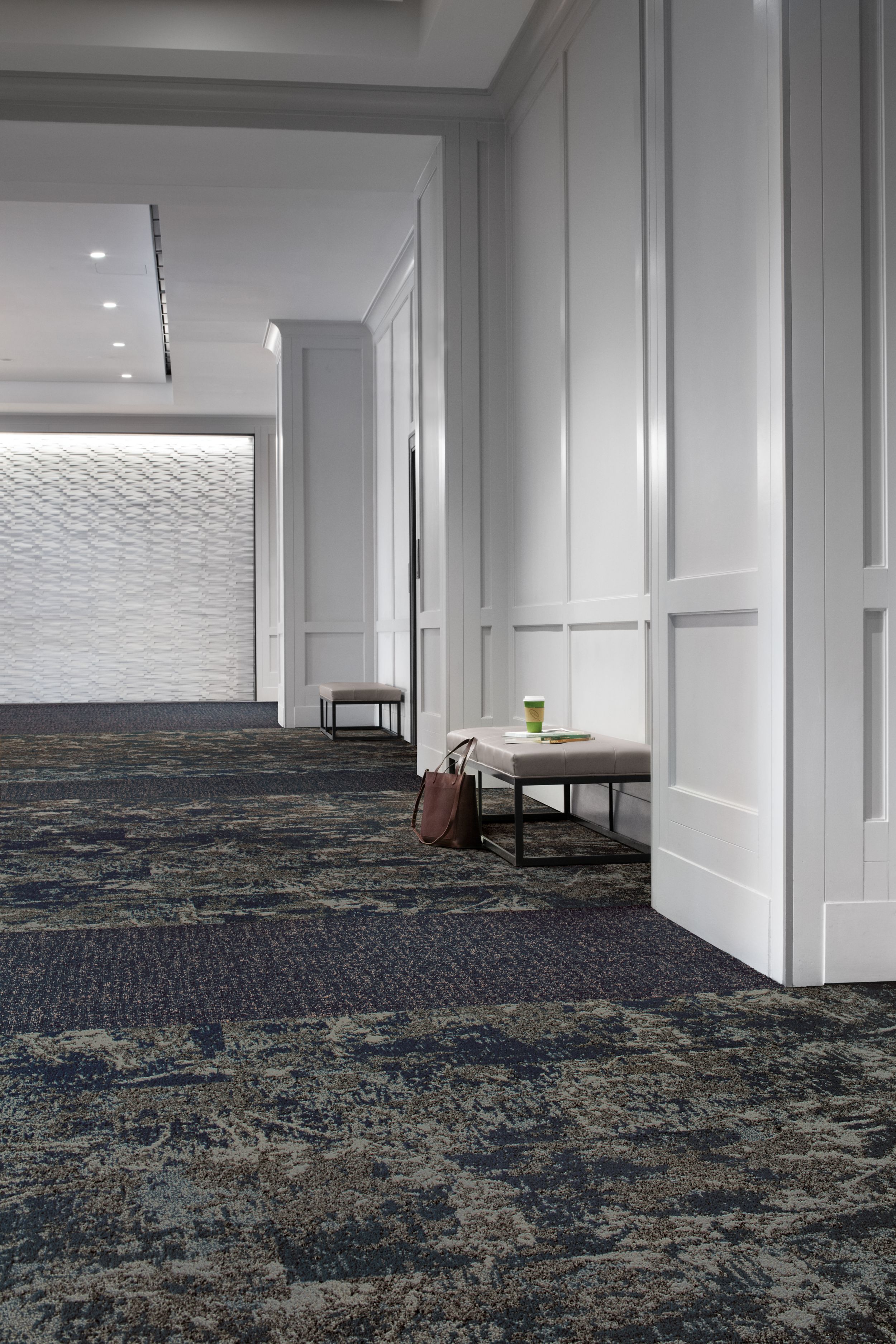 Interface Mirano and Bouquet plank carpet tile in open room with white walls and briefcase next to seat image number 2