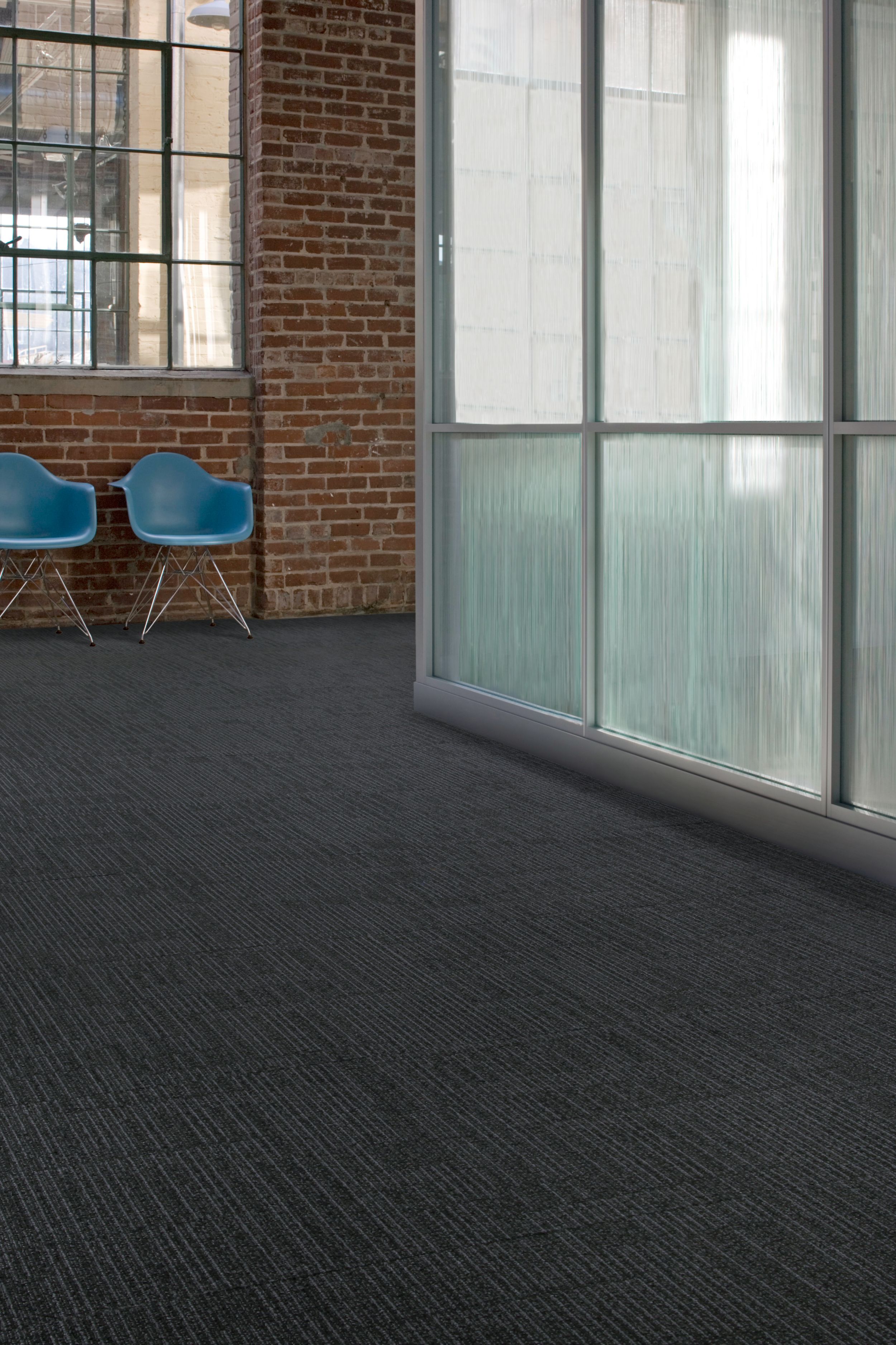 Interface Brescia carpet tile in open space and corridor with two blue chairs image number 8