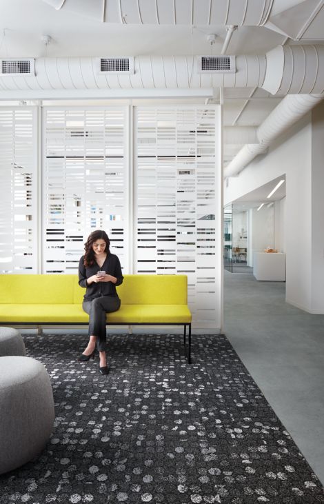 Interface Broome Street carpet tile in waiting area with woman on yellow couch image number 5