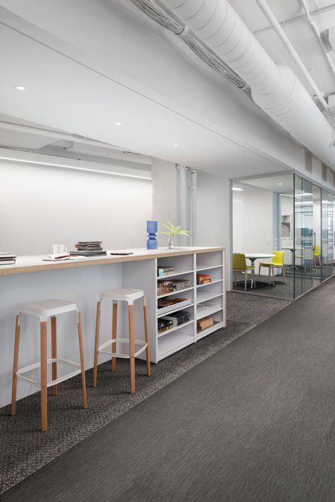 Interface Brushed Lines LVT and Reade Street carpet tile in common work space with high top built in table image number 5