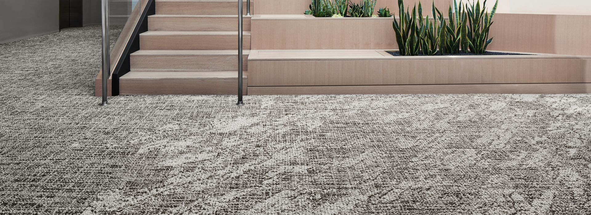 Interface C551 and C552 plank carpet tile in open area with stairs and plants