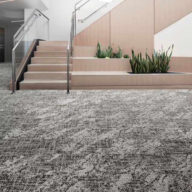 Interface C551 and C552 plank carpet tile in open area with stairs and plants