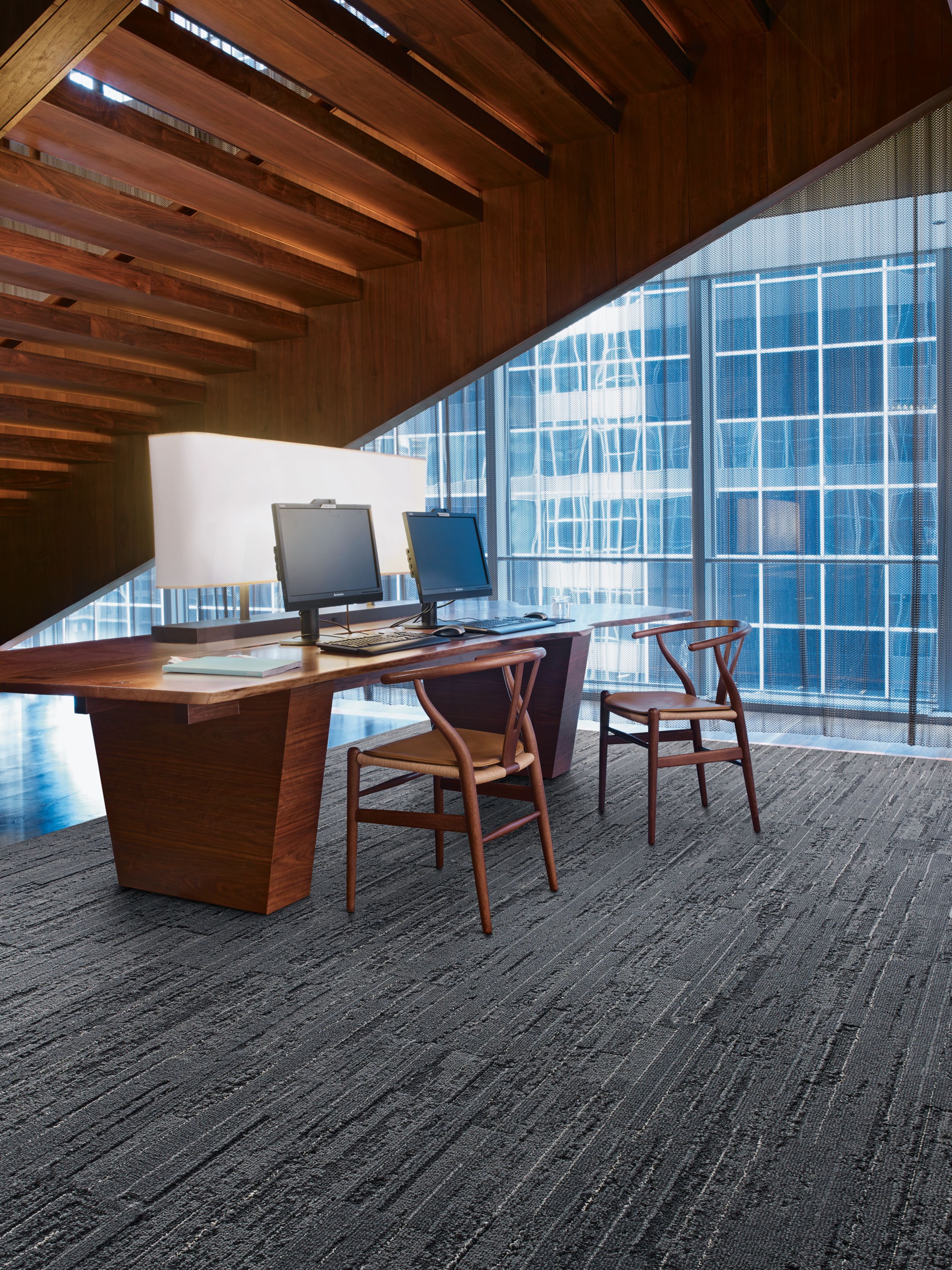 Interface CE172 plank carpet tile in office area with desk beneath stairwell image number 4