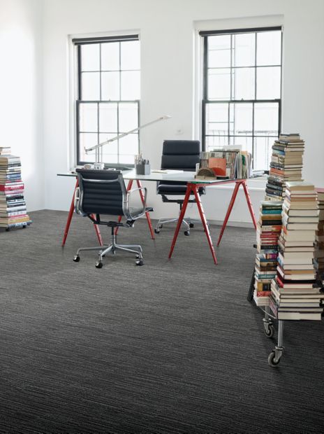 Interface CT102 carpet tile in private office with stacks of books