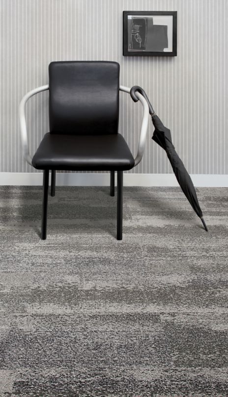 Interface CT112 plank carpet tile in room with black chair and umbrella