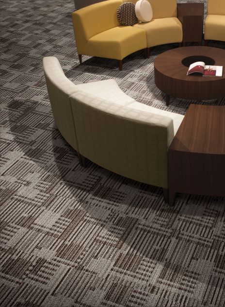 Detail of Interface Cordoba carpet tile with circular benches