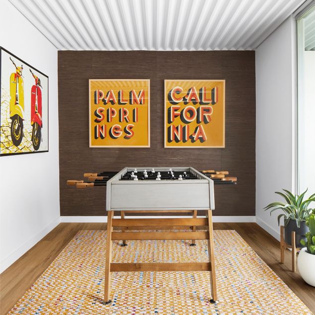 FLOR Check it Out carpet tile in recreation room with foosball table