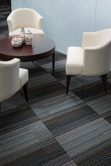 Interface Chenille Warp carpet tile in seating area with table and three chairs image number 5