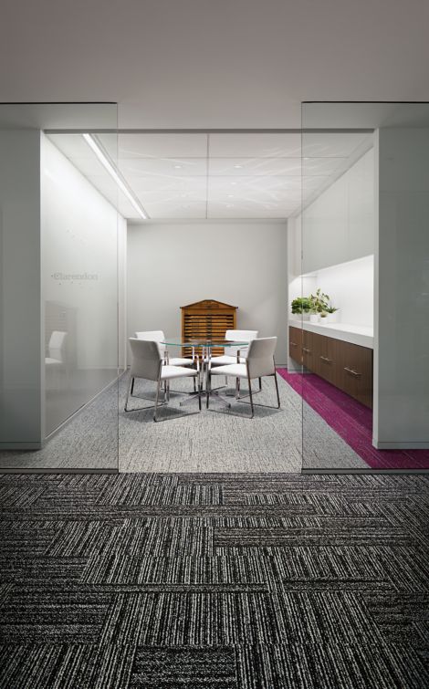 Interface Decibel, Circuit Board, and Haptic plank carpet tile in seating area with glass table and white chairs