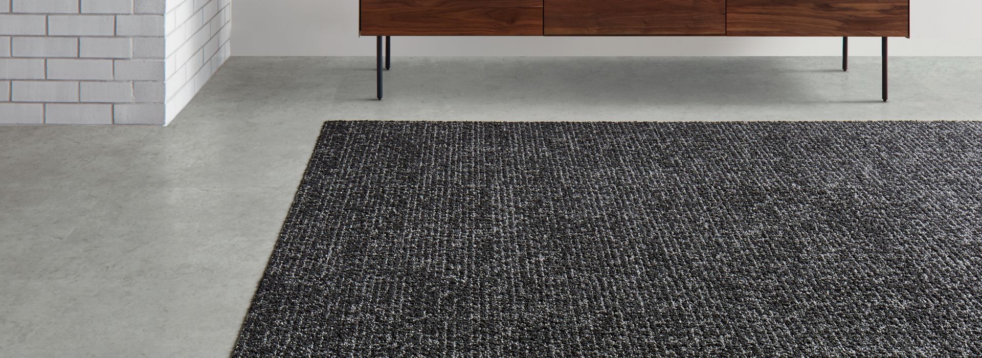 Interface Classic Seven carpet tile with Textured Stones LVT in lobby area 
