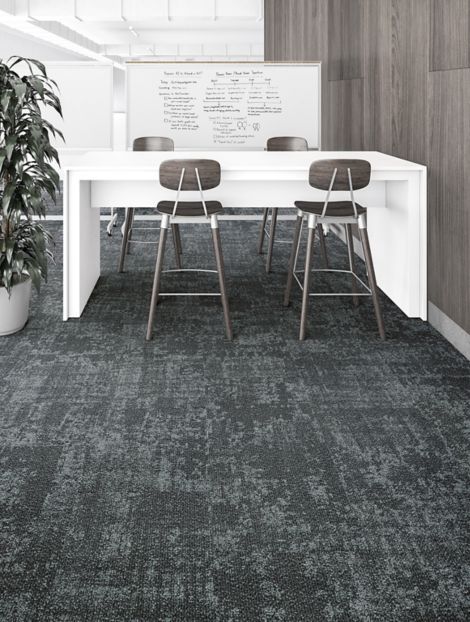 Interface Cloud Cover carpet tile in office with white desk and stools with plant