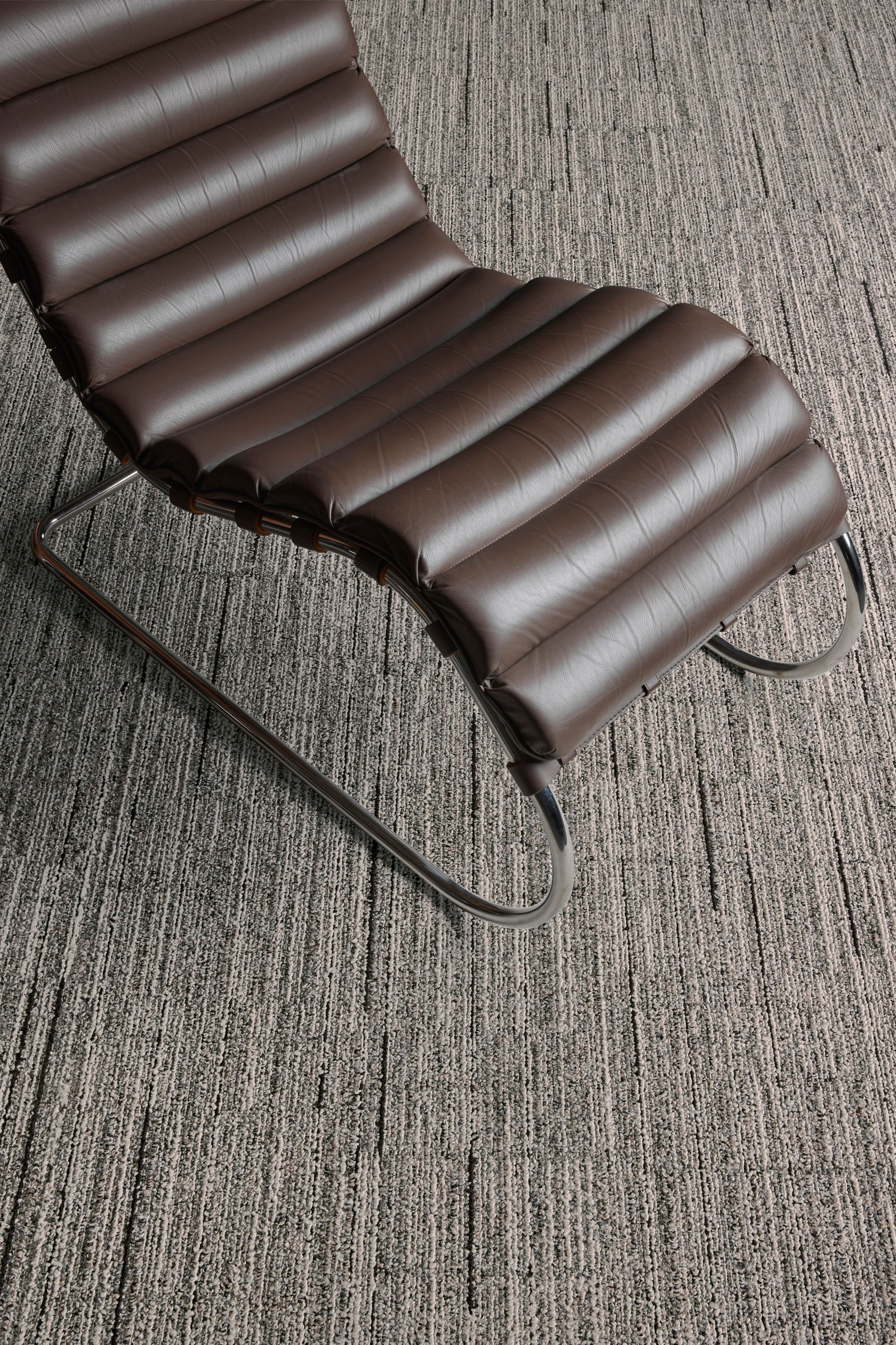 Interface Comes Around plank carpet tile in close-up with MR Lounge Chair image number 4