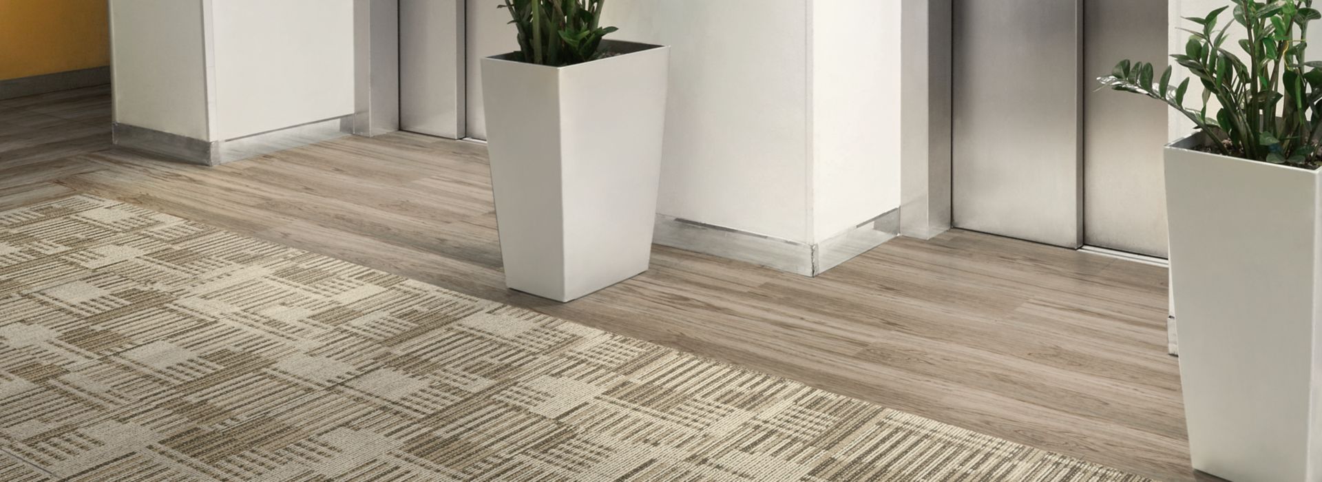 Interface Cordoba carpet tile and Natural Woodgrains LVT by elevator lobby image number 1