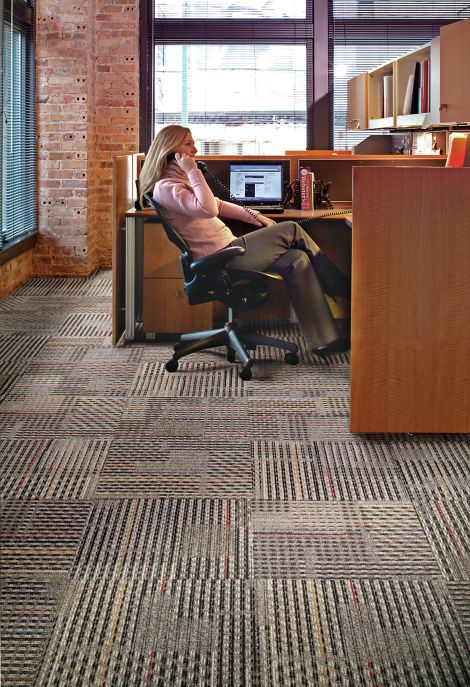 Interface Cotswold II carpet tile in open office with woman on phone image number 4
