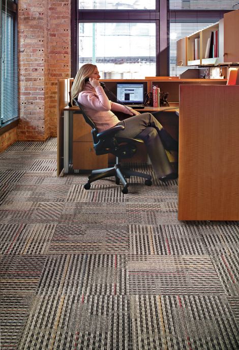 Interface Cotswold II carpet tile in open office with woman on phone image number 10