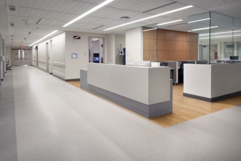 Interface Criterion Classic Woodgrains LVT and noraplan eco rubber flooring in hospital common area