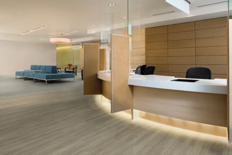 Interface Criterion Classic Woodgrains and Criterion Classic Wovens LVT in waiting area with couch and reception area